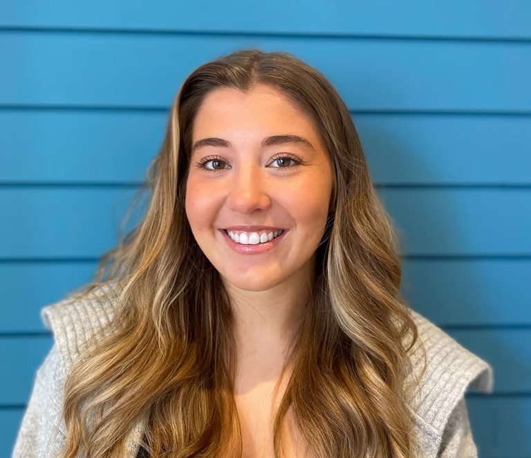 alt="Sam, Clinic Assistant and Personal Trainer at Inverclyde Chiropractic, looking friendly and approachable."